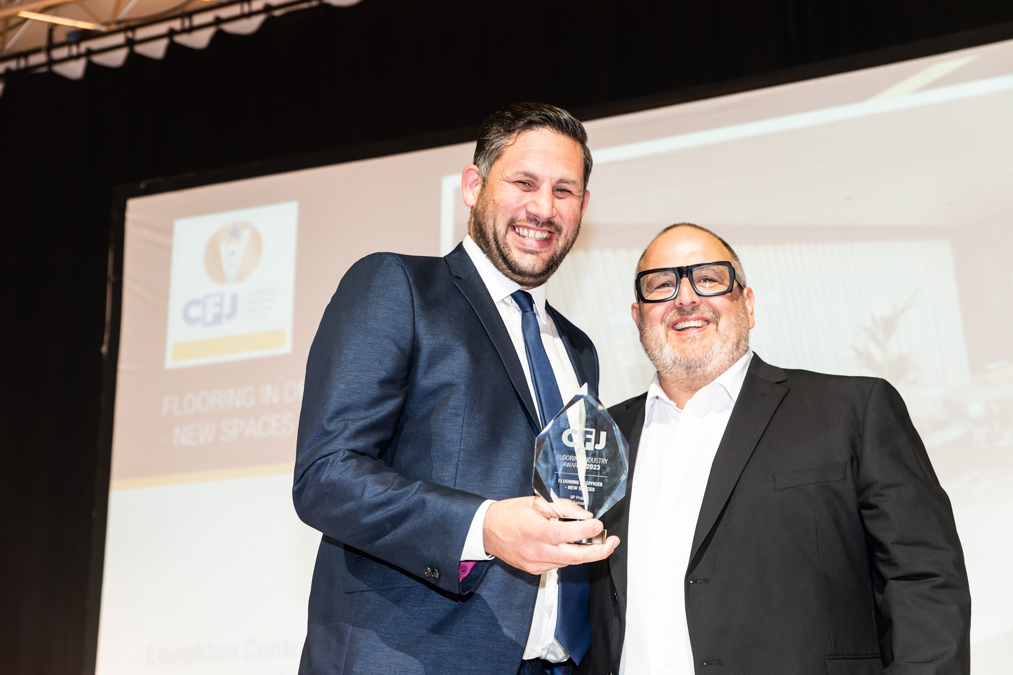 Ross Cooper accepting the award for Installation of the Year for Loughton Contracts, at the CFJ Awards 2023.